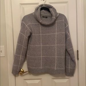 Grey sweater with white stripes